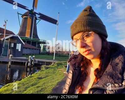 woman winter tourist holiday in zaanse schans in netherlands Stock Photo