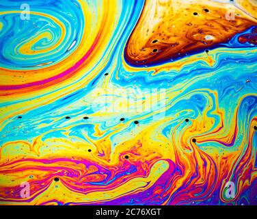 Coloful rainbow psychedelic abstract patternt on soap bubble surface. Macro shot for design Stock Photo