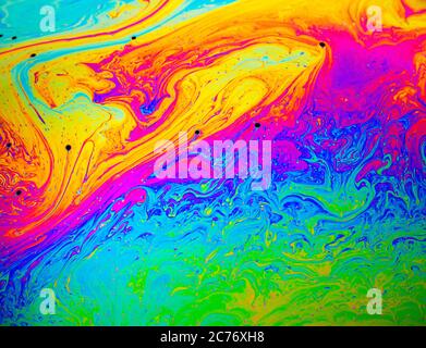 Coloful rainbow psychedelic abstract patternt on soap bubble surface. Macro shot for design Stock Photo