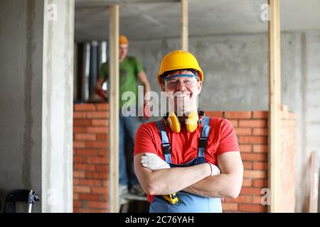 Happy handyman in uniform Stock Photo