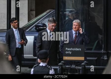 Westminster, London, UK. 14th July, 2020. Jacob Rees-Mogg, Leader of the House of Commons and Rishi Sunak, Chancellor of the Exchequer, with others. Cabinet ministers, senior Conservative MPs and Labour front bench politicians can be seen in the grounds of the House of Commons just before the Flammable Cladding Removal debate in the Commons. Credit: Imageplotter/Alamy Live News Stock Photo
