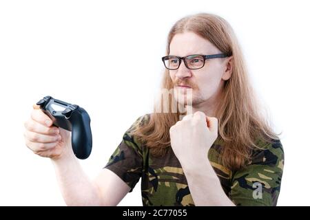 Long Haired Gamer Success Pumping Fist Holding Video Game Controller Stock Photo
