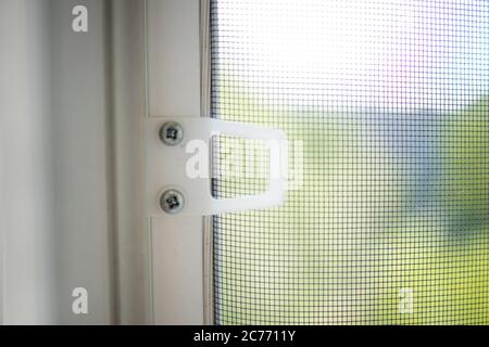 Mosquito wire screen or mosquito net on a PVC window. Protection against insects. Stock Photo