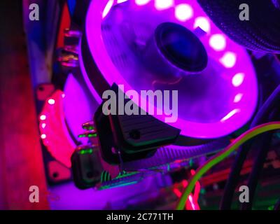 Modern computer air cooling with multi-colored led backlight-fans, cooling radiators, cables, boards, close-up, macro. Stock Photo