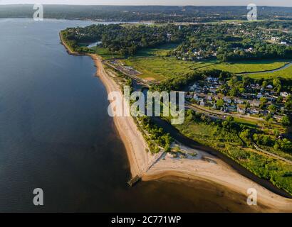 Panoramic view from aerial ocean coastal view, beautiful sand beach town stretching into the distance Stock Photo