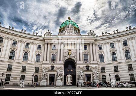 Presidents Residence, Wiener Hofburg, With Fiaker Horses And Coaches In The Inner City Of Vienna In Austria Stock Photo