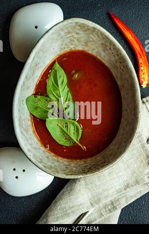 Bowl of  gazpacho soup with basil leaves Stock Photo