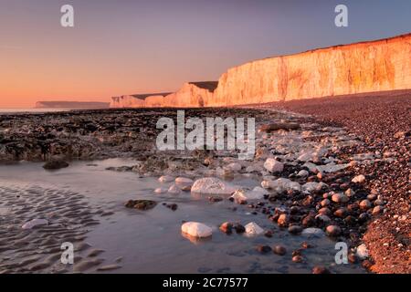The Seven Sisters chalk cliffs at sunset, Birling Gap, South Downs National Park, East Sussex, England, UK Stock Photo