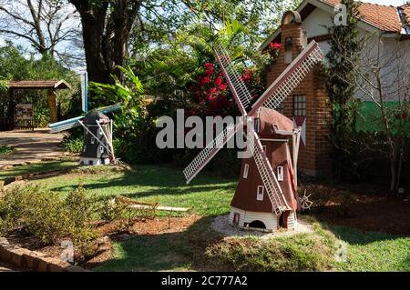 Reduced scale dutch windmills inside a garden near the entrance of Holambra Historical Museum. Museum located at Alameda Mauricio de Nasau street. Stock Photo