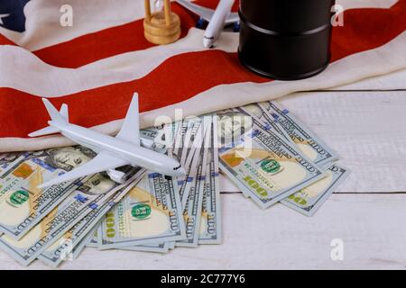 Rising world oil prices brand USA flag model airplane oil barrels on US dollar oil business Stock Photo