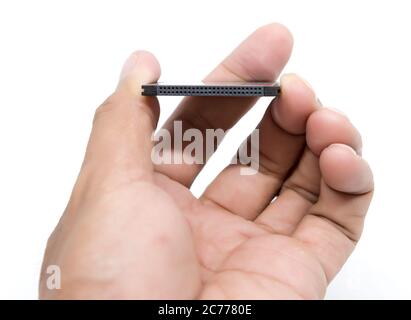 hand holding compact flash memory card Stock Photo