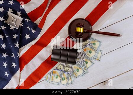Rising world oil prices brand USA flag wooden judge hammer oil barrels on US dollar oil business court showdowns Stock Photo