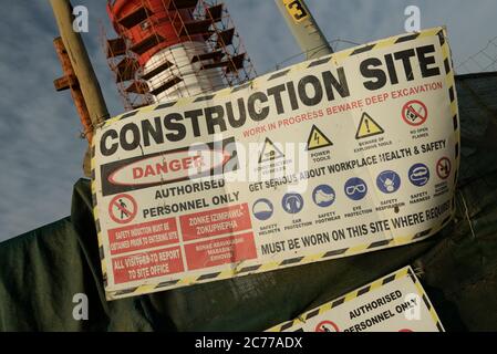 Construction site, health and safety sign, danger, risk, hazard, workplace, Durban, South Africa, work in progress, project, warning, information Stock Photo