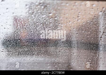 rain drops on back side glass shield car Stock Photo