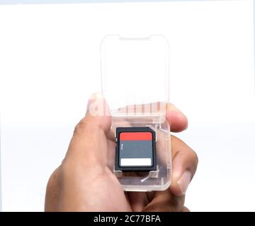 hand holding compact flash memory card Stock Photo