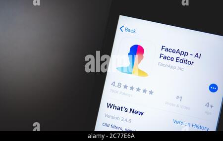 iPhone with Face App logo on the screen. Stock Photo