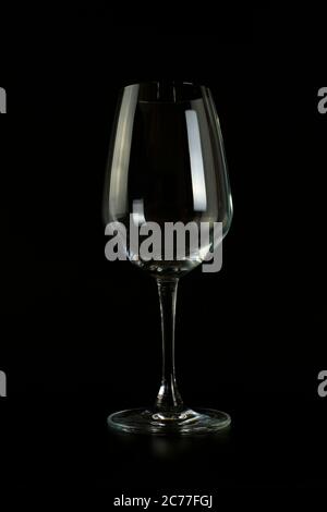 Empty wine glass on black background. Stock Photo
