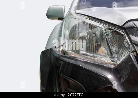 Close up front of gray color car big damaged and broken by accident isolated on white background. Stock Photo