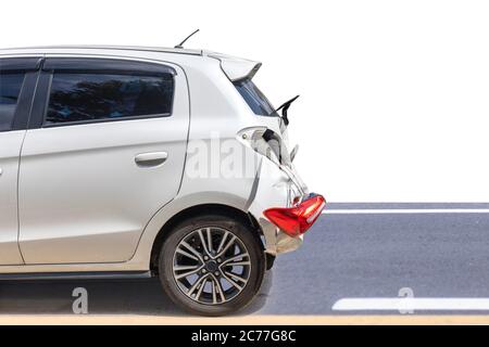 Back side of white color car big damaged and broken by accident on road parking can not drive any more. isolated on white background. Save with clippi Stock Photo