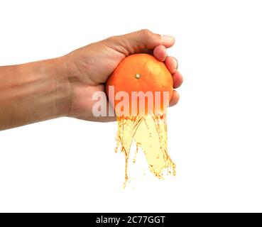 Hand man squeezes orange isolate on white background. Stock Photo