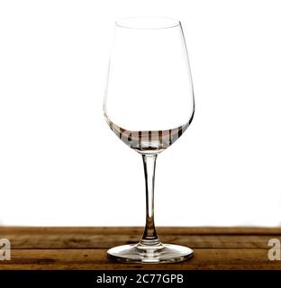 Emty wine glass on wood table. Isolate on white background. Stock Photo