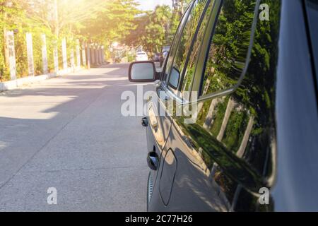 Side wing mirror and door handle black color car Stock Photo