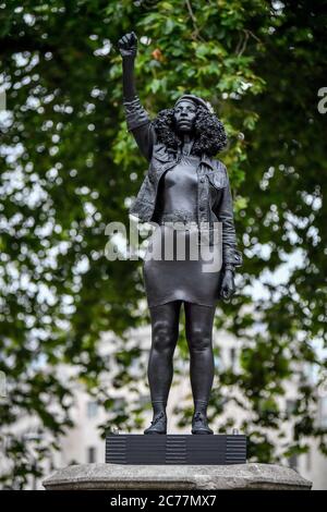 A black resin and steel statue titled A Surge of Power (Jen Reid) 2020, by Marc Quinn is installed on the vacant Edward Colston plinth in Bristol city centre. Stock Photo