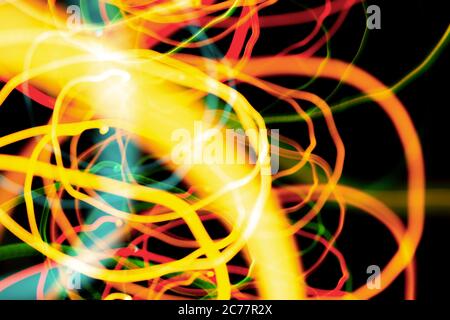 Christmas lights in blurry focus and motion long-exposure photo. Abstract background. Swirl effect. New year, power energy, LED, sci-fi, neon, magic,