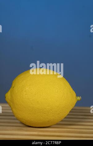 Citrus fruits- lemon, on the wooden , On a blue background Stock Photo