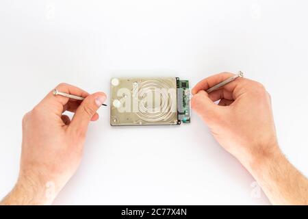a man repairs hard drive Stock Photo