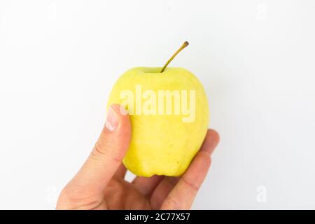 apple in hand on white background Stock Photo