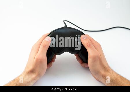 game joystick in hand on white background Stock Photo