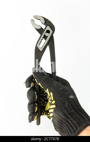 adjustable spanner in the hand of builder Stock Photo