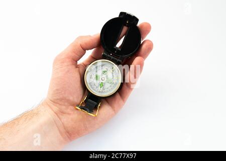 compass in hand on white background Stock Photo