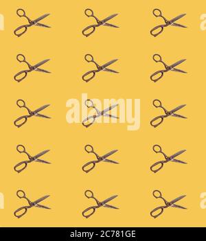 seamless pattern of rusty scissors on the orange background Stock Photo