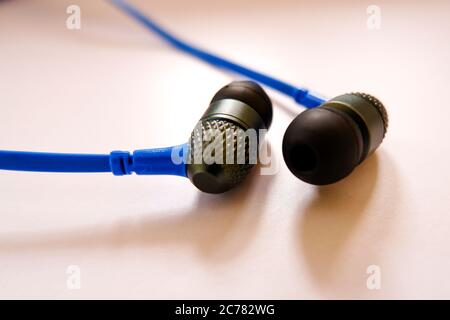 a closeup view of headphone earbuds isolated on white background Stock Photo