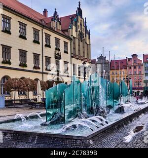 Poland, Wroclaw city,province of Lower Silesia, Rynek is surrounded by the tenement houses funded by the patricians of Wroc&#x142,aw. In 2000 a fountain was installed on Go&#x142,&#x119,bi Square, in the western part of Rynek, and was called Zdr&#xf3,j from the name of the then President of Wroc&#x142,aw, Bogdan Zdrojewski. Stock Photo