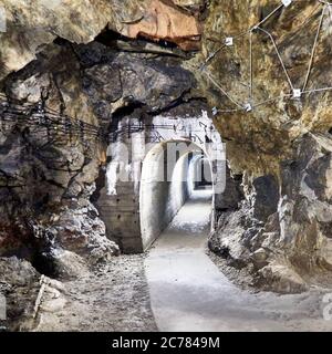 Poland, Walbrzych, Lower Silesian,  Nazi tunnels.      50 meters, under the castle of Ksiaz huge tunnels with a total length of 2 km have been dug in the rock base under the  Ksiaz castle.It is assumed that a railway from Lubiechow to the castle was planned and Hitler considered basing himself here during the latter part of the Second World War,  The construction work was done by forced labourers, prisoners of war, and prisoners of concentration camps, and many lost their lives, mostly as a result of disease and malnutrition Stock Photo