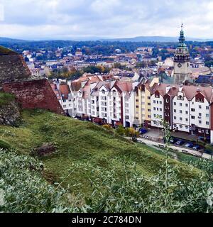 Poland. Lower Silesian, Voivodeship   Old tenements and a fragment of the fortress Klodzko wall   and  View of the city Klodzko from the fortress, and, City Hall with Renaissance Tower Stock Photo