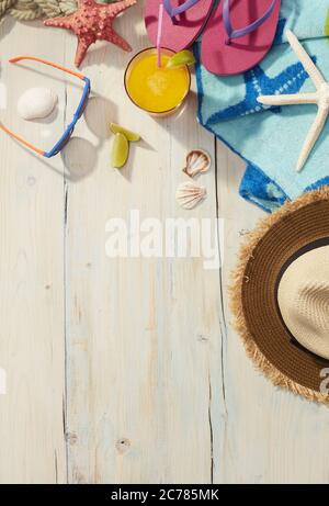 Beach items on a wooden background Stock Photo