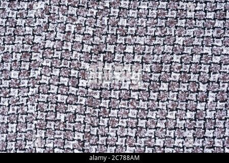 Gray and white wool fabric with a pattern of teeth. Background Stock Photo