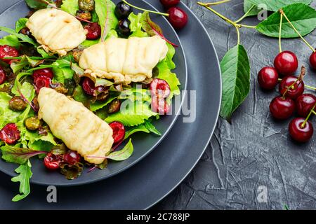 Summer salad of leaf lettuce,fried halloumi cheese and cherry berries Stock Photo