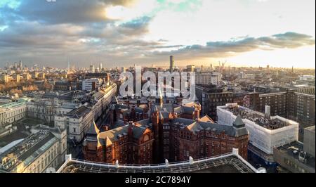 Sunset over University College London Cruciform Building and London skyline Stock Photo