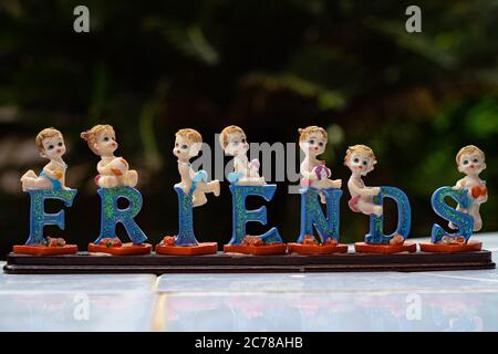 Ceramic dolls on each letter that spells as friends. A very beautiful souvenir for friends. Stock Photo
