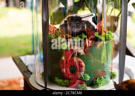 Birthday cake with red number six and tank. Focus is on cake. cake for boy Stock Photo