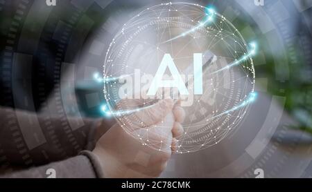 Hand holding mobile device with glowing sphere hologram Stock Photo