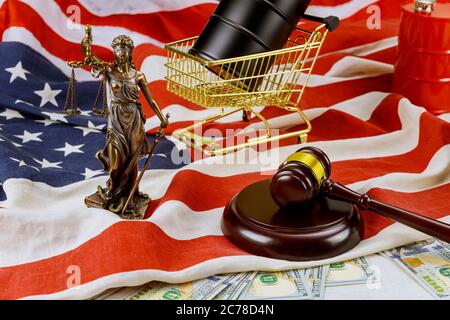 Oil barrels on US dollar oil business, rising world oil prices brand wooden judge hammer USA flag court showdowns Stock Photo