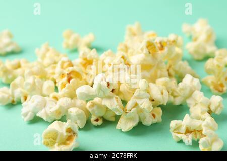 Tasty popcorn on mint background. Food for watching cinema Stock Photo