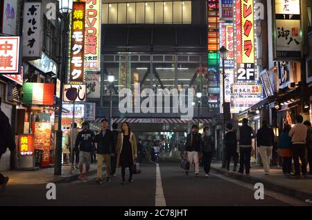 Shoppers in a Busy Shibuya Street - Tokyo, Japan Stock Photo