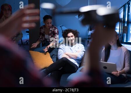 Young team of experienced professionals planning the development of new successful project. Diverse group of architects working in coworking office us Stock Photo